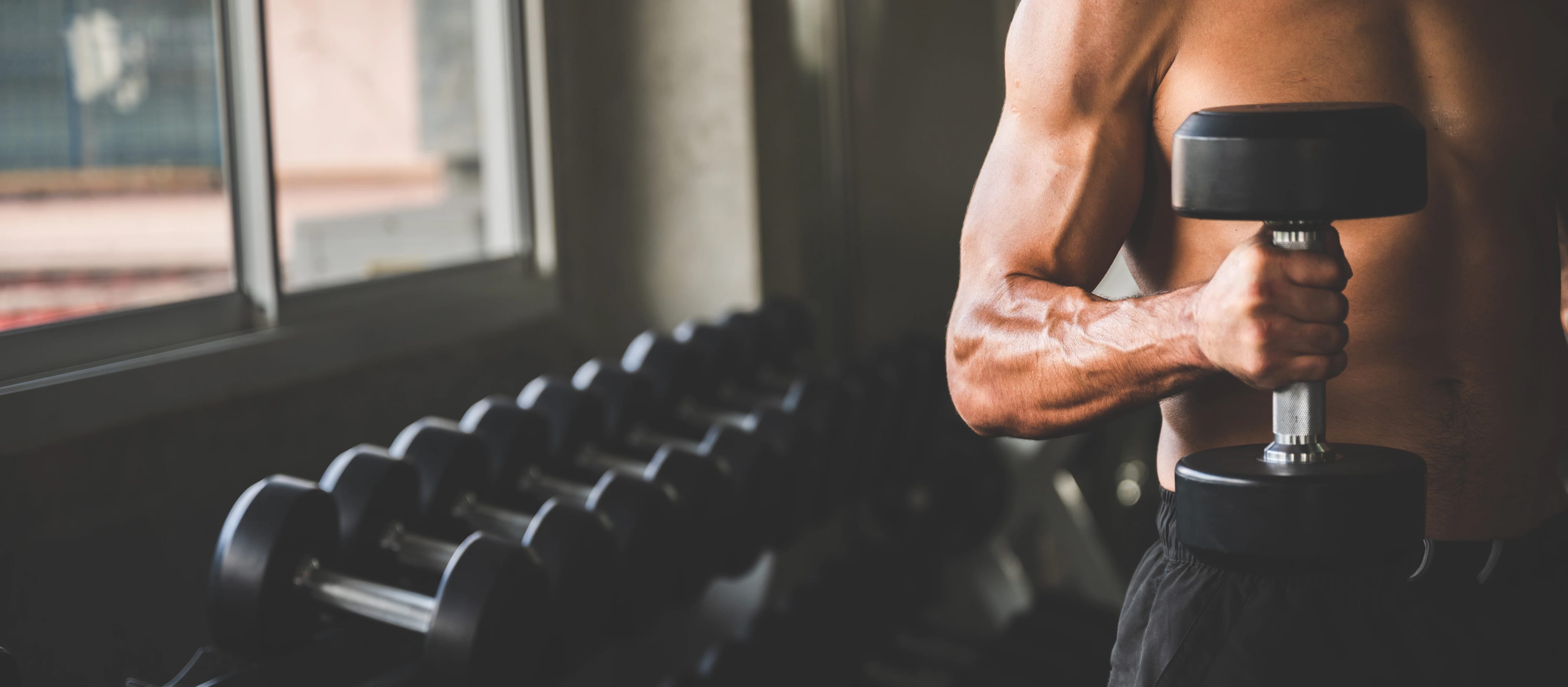 Athlete training with kettlebells